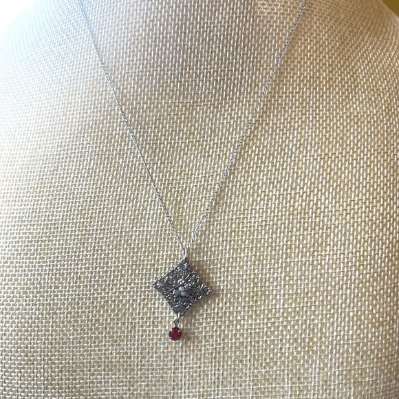 Marvel Jewelry Marvel Sterling Silver Ornate Flower Pendant With A Dangly Red Stone Poshmark